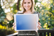 Free Tablet Mockup With Woman In Nature Psd