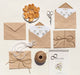 Free Top View Arrangement Of Brown Paper Envelopes And Wedding Rings Psd
