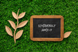 Free Top View Blackboard Mock-Up And Paper Leaves Psd