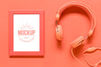 Free Top View Coral Arrangement With Frame Mock-Up And Headphones Psd