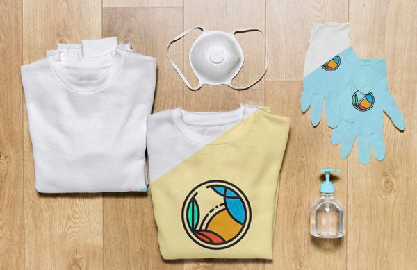 Free Top View Folded Hoodies Mock-Up With Gloves, Mask And Hand Sanitizer Psd