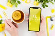 Free Top View Hands Holding Smartphone Mock-Up With Tea Psd