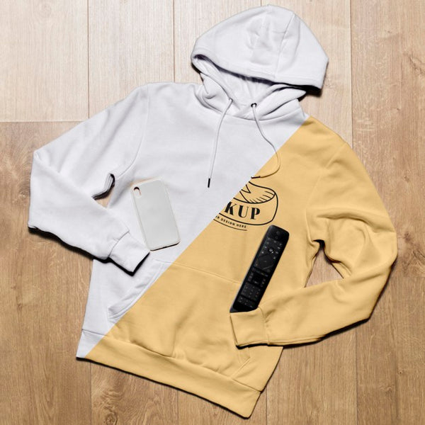Free Top View Hoodie Mock-Up With Phone Case And Tv Remote Psd
