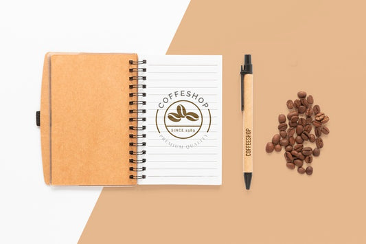 Free Top View Notebook And Coffee Beans Psd