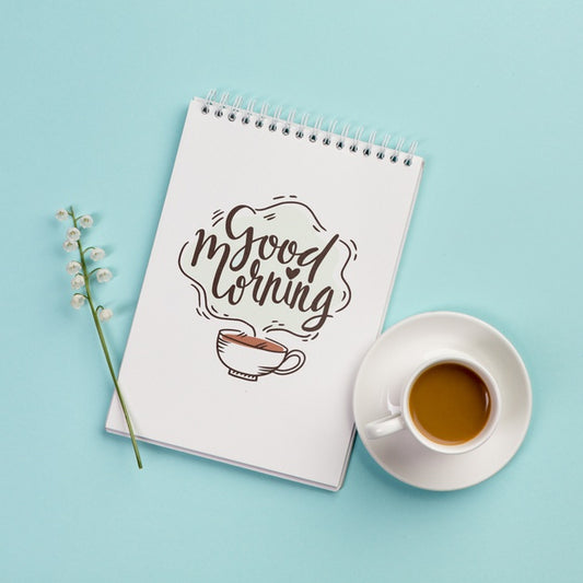 Free Top View Notebook With Positive Message And Coffee Psd