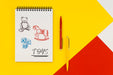 Free Top View Notepad Mock-Up On Colorful Background Psd