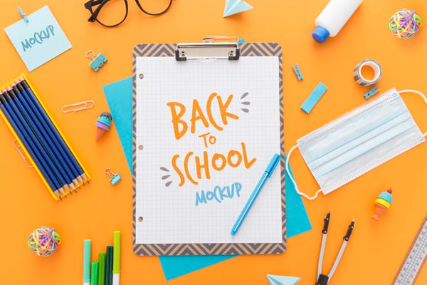 Free Top View Of Back To School Notepad With Pencils And Essentials Psd