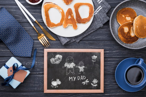 Free Top View Of Blackboard For Fathers Day With Pancakes And Gift Psd