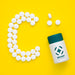Free Top View Of Bottle With Pills In Shape Of C Psd