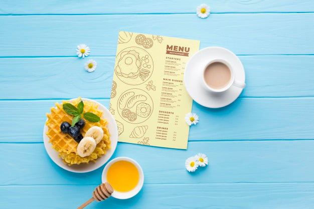 Free Top View Of Breakfast Food With Waffles And Honey Psd