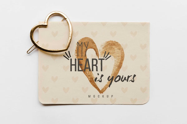 Free Top View Of Card With Heart-Shaped Golden Pin Psd