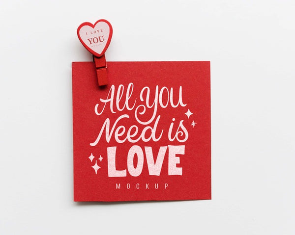 Free Top View Of Card With Paper Heart And Pin Psd