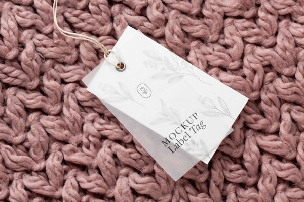 Free Top View Of Clothing Label Mock-Up On Knitted Fabric Psd
