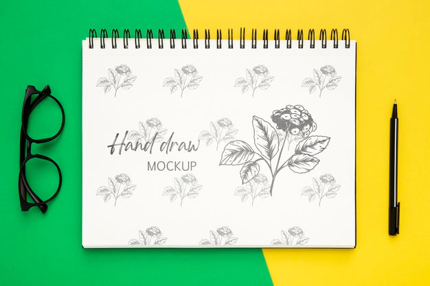 Free Top View Of Desk Surface With Notebook And Glasses Psd
