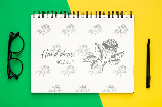 Free Top View Of Desk Surface With Notebook And Glasses Psd