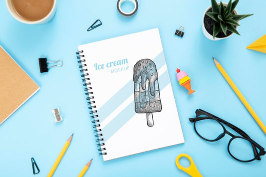 Free Top View Of Desk Surface With Notebook And Glasses Psd