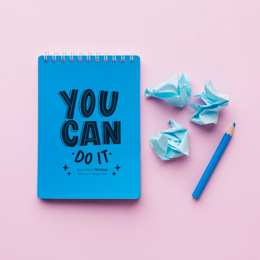Free Top View Of Desk With Notebook And Crinkled Paper Psd