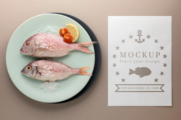 Free Top View Of Fish On Plate With Salt And Tomatoes Psd