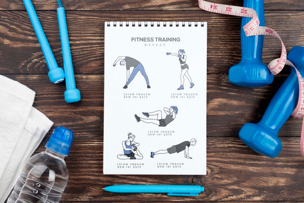 Free Top View Of Fitness Notebook With Weights And Water Bottle Psd