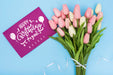 Free Top View Of Happy Birthday Bouquet Of Tulips With Card For Anniversary Celebration Psd