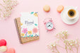 Free Top View Of Notebook With Clock And Macarons Psd