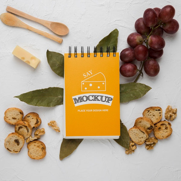 Free Top View Of Notebook With Grapes And Cheese Psd