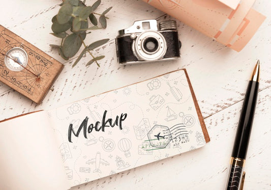 Free Top View Of Paper With Compass And Camera For Traveling Psd
