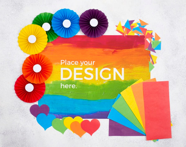 Free Top View Of Rainbow Flag With Rosettes And Hearts Psd