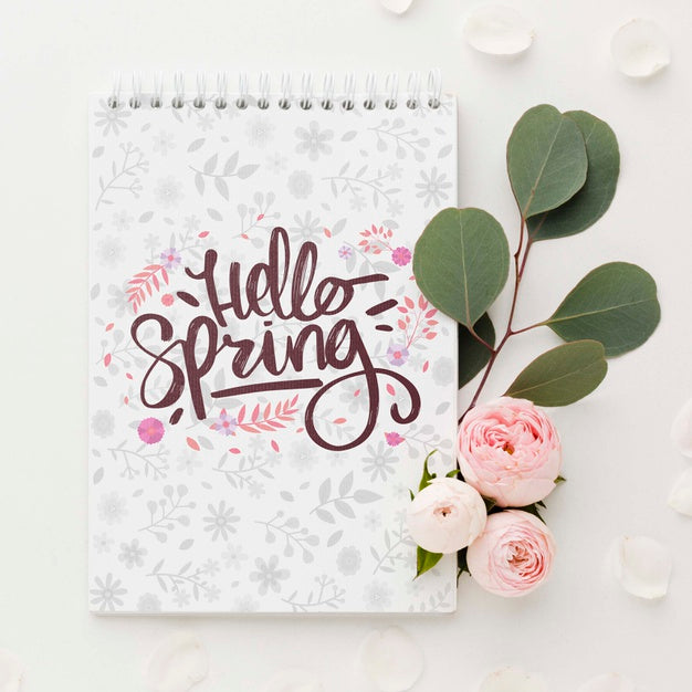 Free Top View Of Roses And Leaves With Notebook Psd