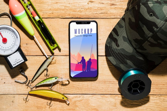 Free Top View Of Smartphone With Fishing Bait Psd