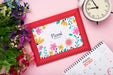 Free Top View Of Spring Flower With Calendar And Frame Psd