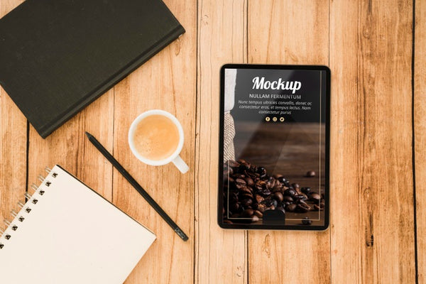 Free Top View Of Tablet With Coffee Cup And Notebook Psd