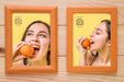 Free Top View Of Two Frames On Wooden Background Psd
