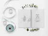 Free Top View Of Wedding Notebook With Ribbon And Rings Psd