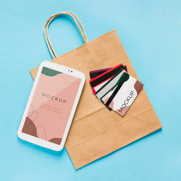 Free Top View Paper Bag Mock-Up With Mobile Phone And Cards Psd