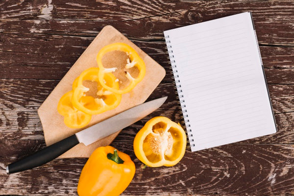 Free Top View Peppers With Notebook Psd