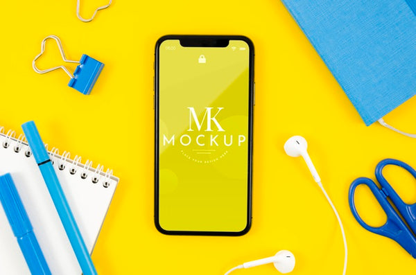 Free Top View Smartphone Mock-Up With Earphones And Stationery Psd