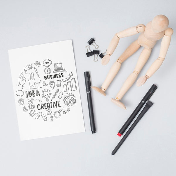 Free Top View Wooden Doll With Pens Psd