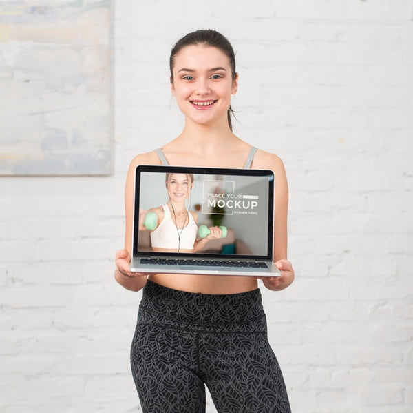 Free Trainer Holding A Laptop Mock-Up Psd