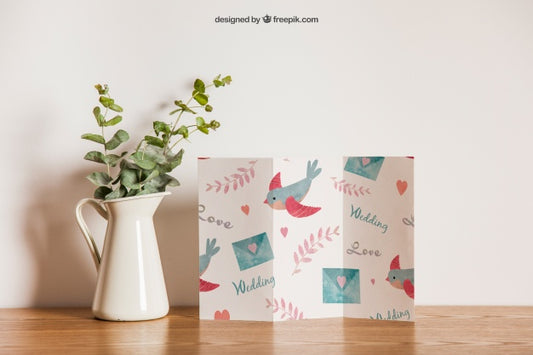 Free Trifold Paper Next To Flower Psd