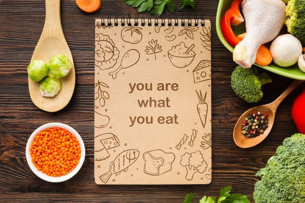 Free Vegetables On Table Beside Notebook Psd
