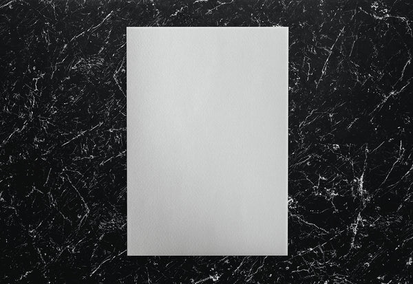 Free White Paper On A Black Marble Background