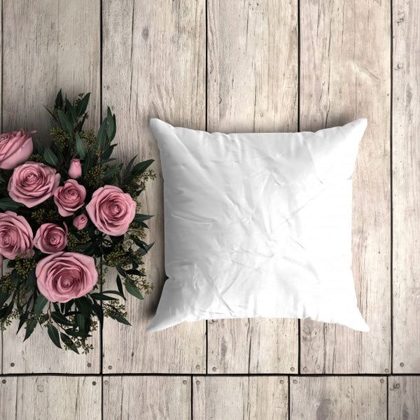 Free White Pillowcase Mockup On A Wooden Plank With Decorative Roses Psd