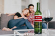 Free Wine Mockup With Couple On Couch Psd