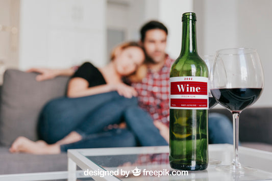 Free Wine Mockup With Couple On Couch Psd