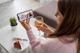 Free Woman Celebrating At Home With Friends Over Smartphone And Drink Psd