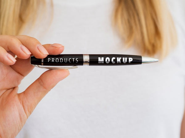 Free Woman Holding A Black Pen Mock-Up Psd