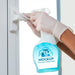 Free Woman Holding A Cleaning Product With Mock-Up Packaging Psd