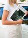 Free Woman Holding A Magazine Next To A Car Mock Up Psd