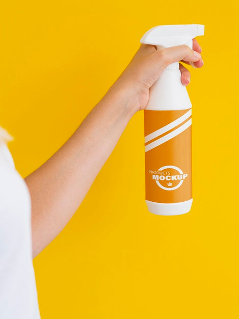 Free Woman Holding A Spraying Bottle Mock-Up Psd